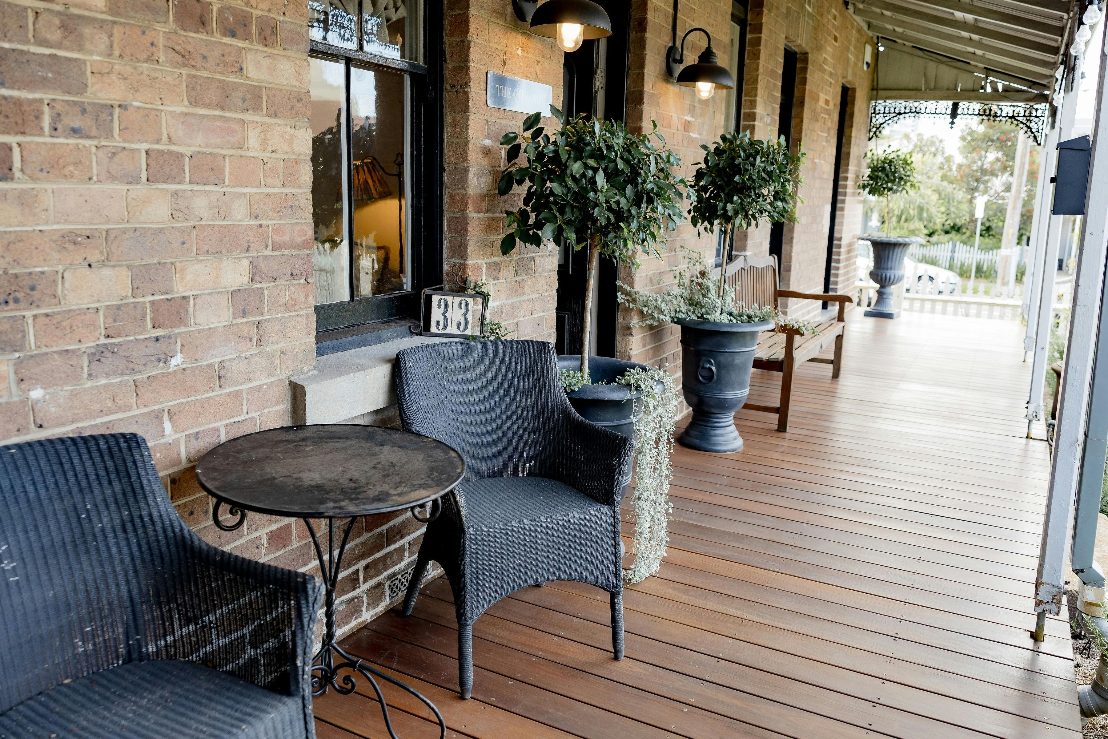 Heritage listed cottage in Wollongong with a front porch and several table settings to enjoy