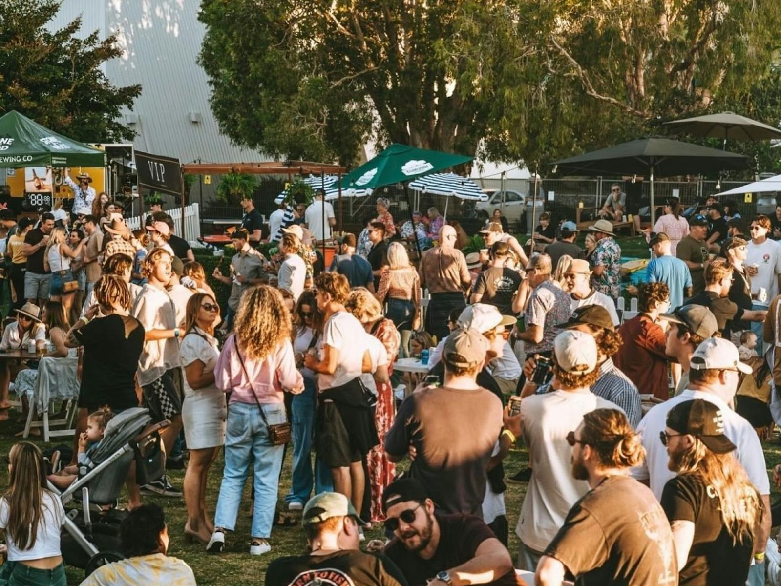 Crowd of people gathered with live music in the background