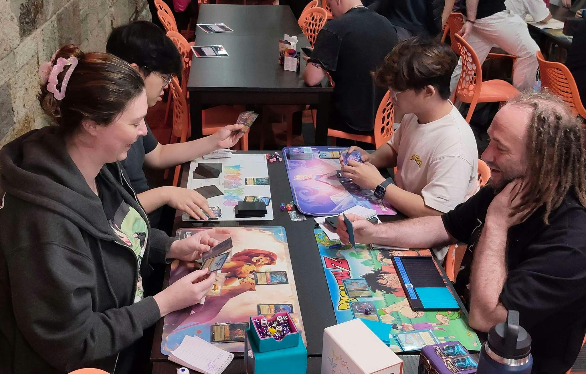Players enjoying a game of Disney Lorcana
