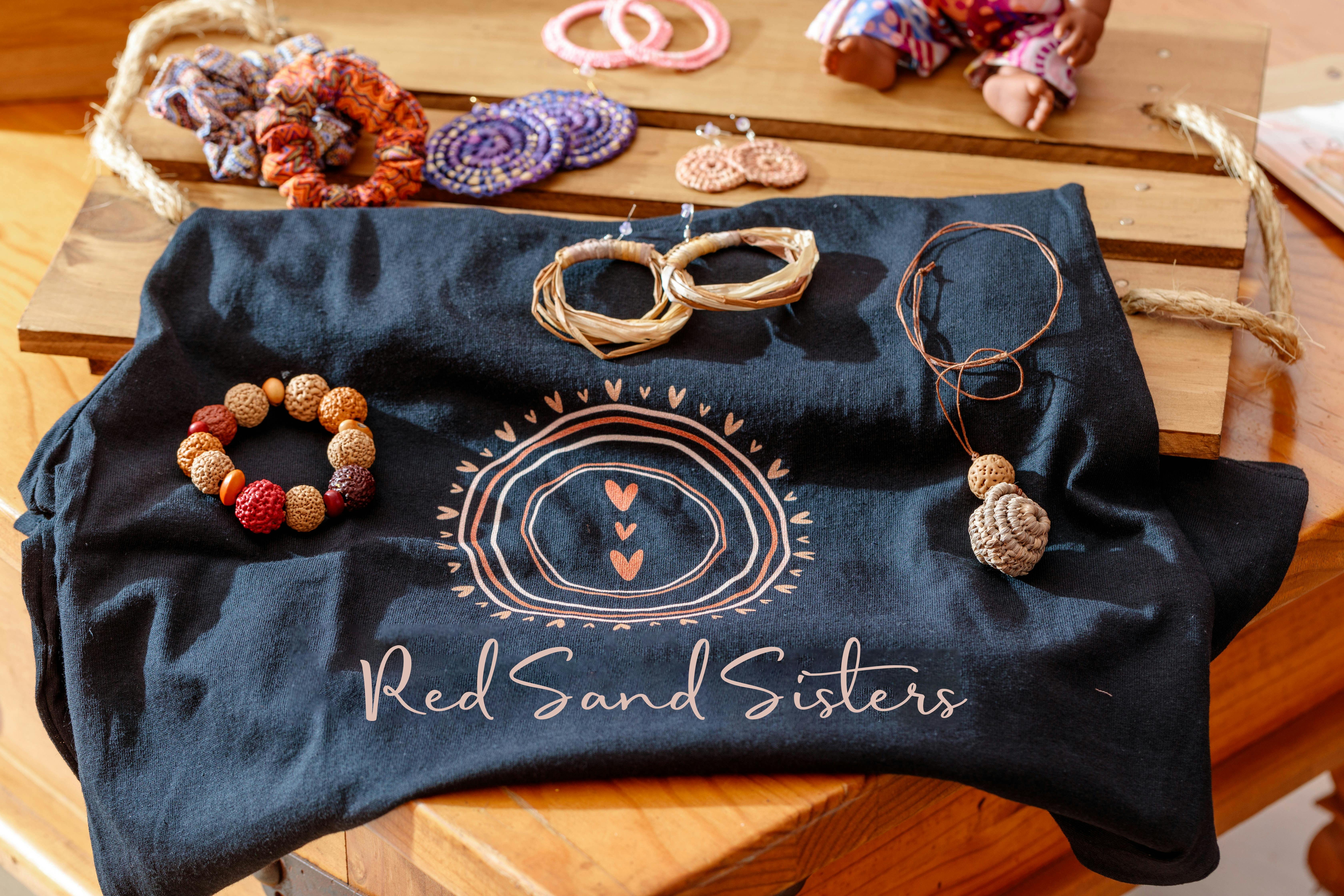Picture shows Red Sand Sisters Tshirt, Quandong seed bracelets, hand woven earrings, scrunchies