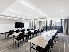 Conference room with tables and screen