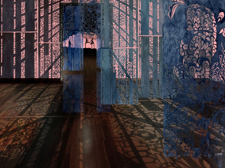 The image features an artistic room with hand-cut-out mixed media works, casting beautiful shadows.