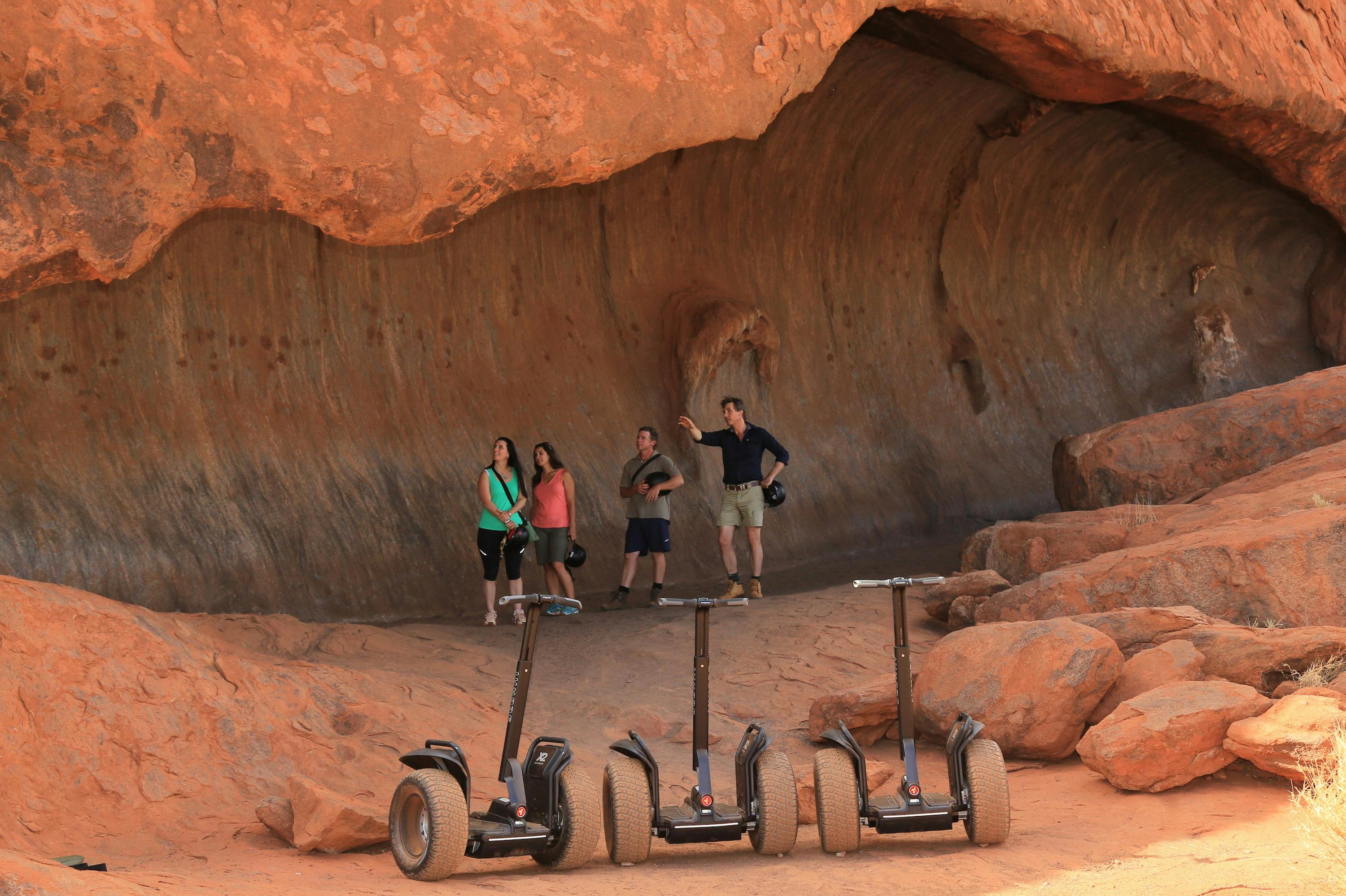 Our guide will lead you on foot so you can explore some of Uluru's most impressive caves.