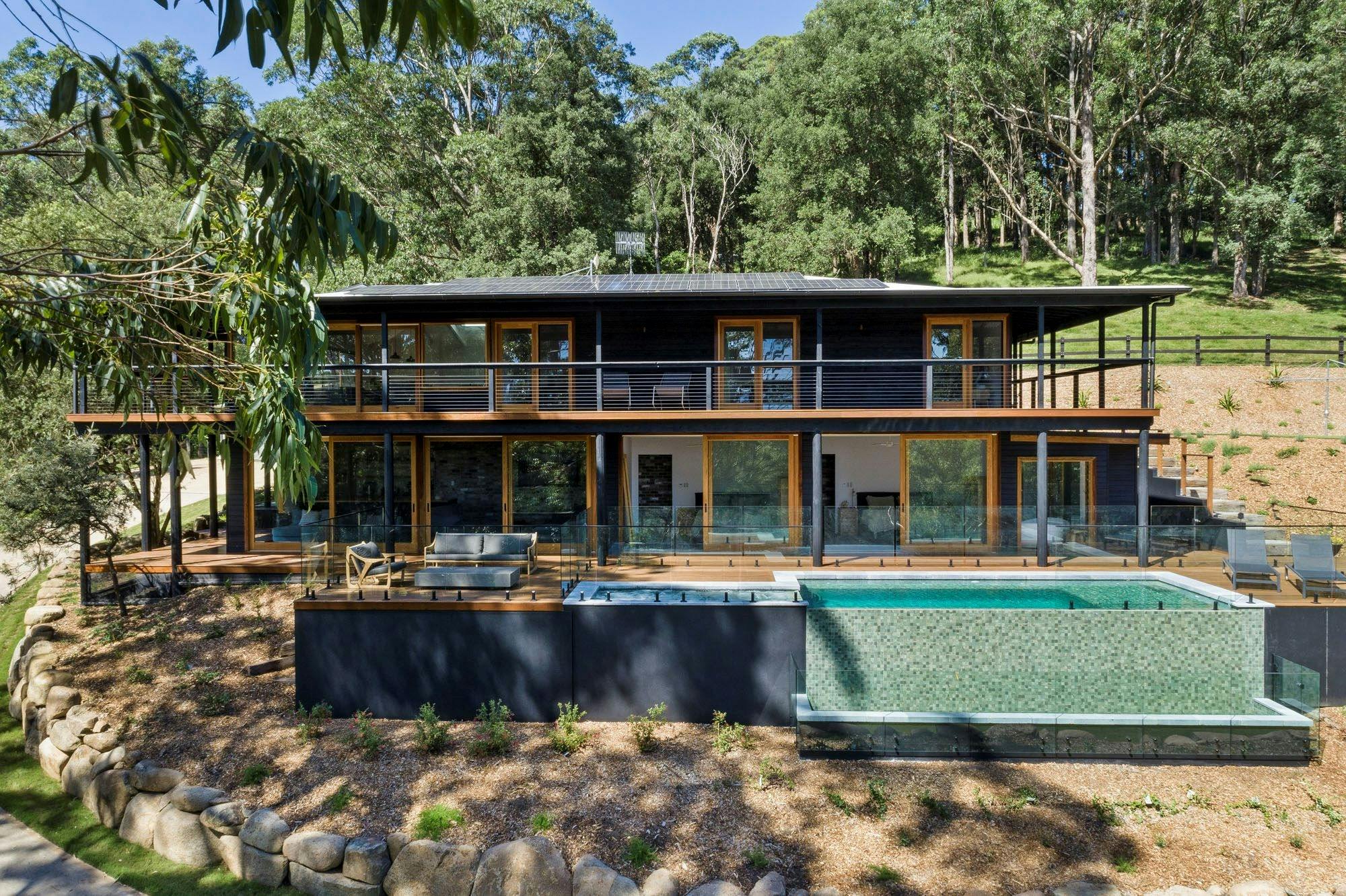 Eucalypt Retreat featuring infinity pool and spa, 3 luxury bathrooms and 6 bedrooms open to deck