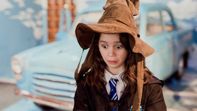 Young girl wearing a sorting hat