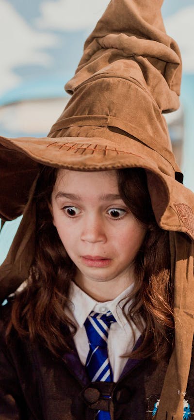 Young girl wearing a sorting hat