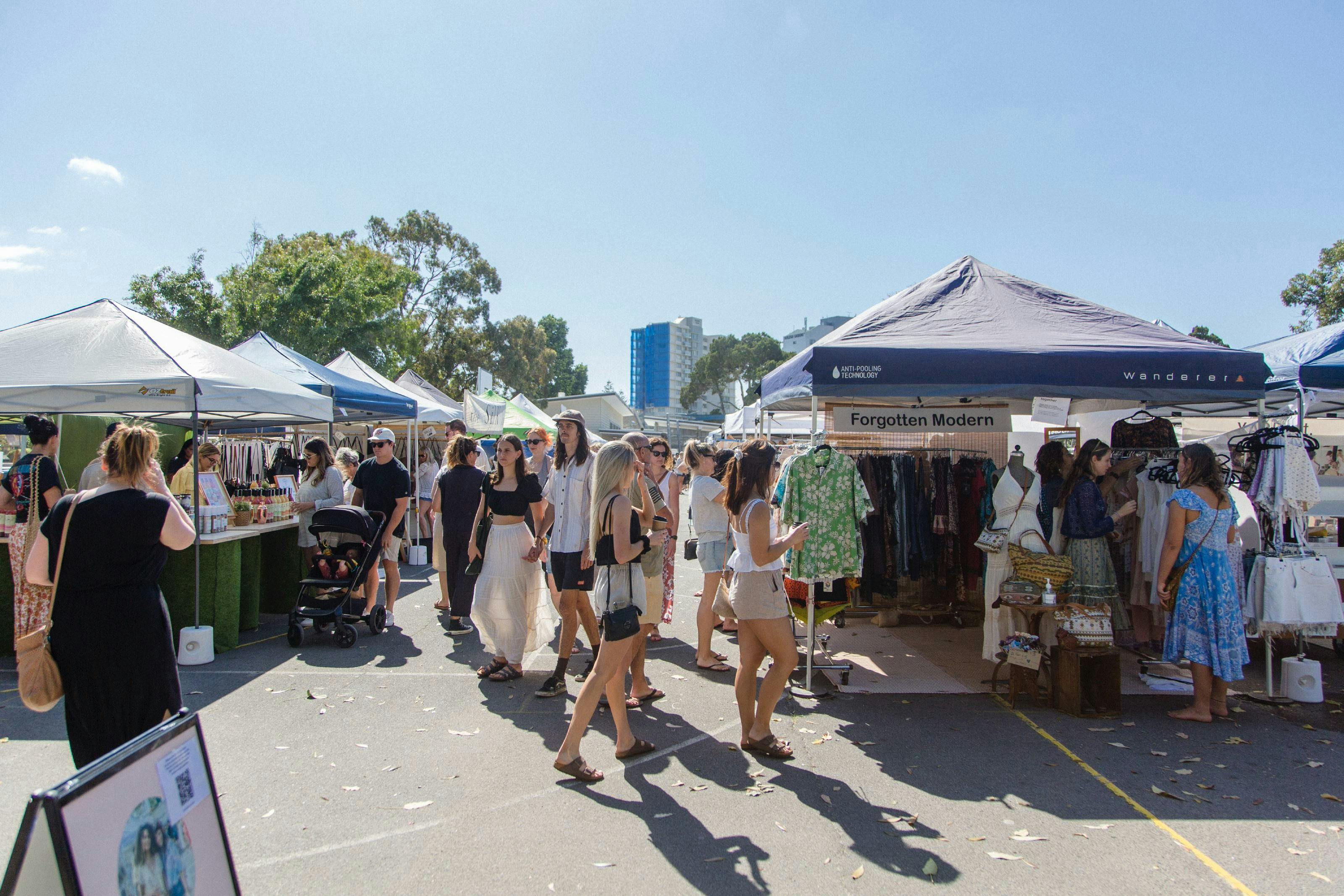 Market shoppers soaking up the sun at The Village Markets