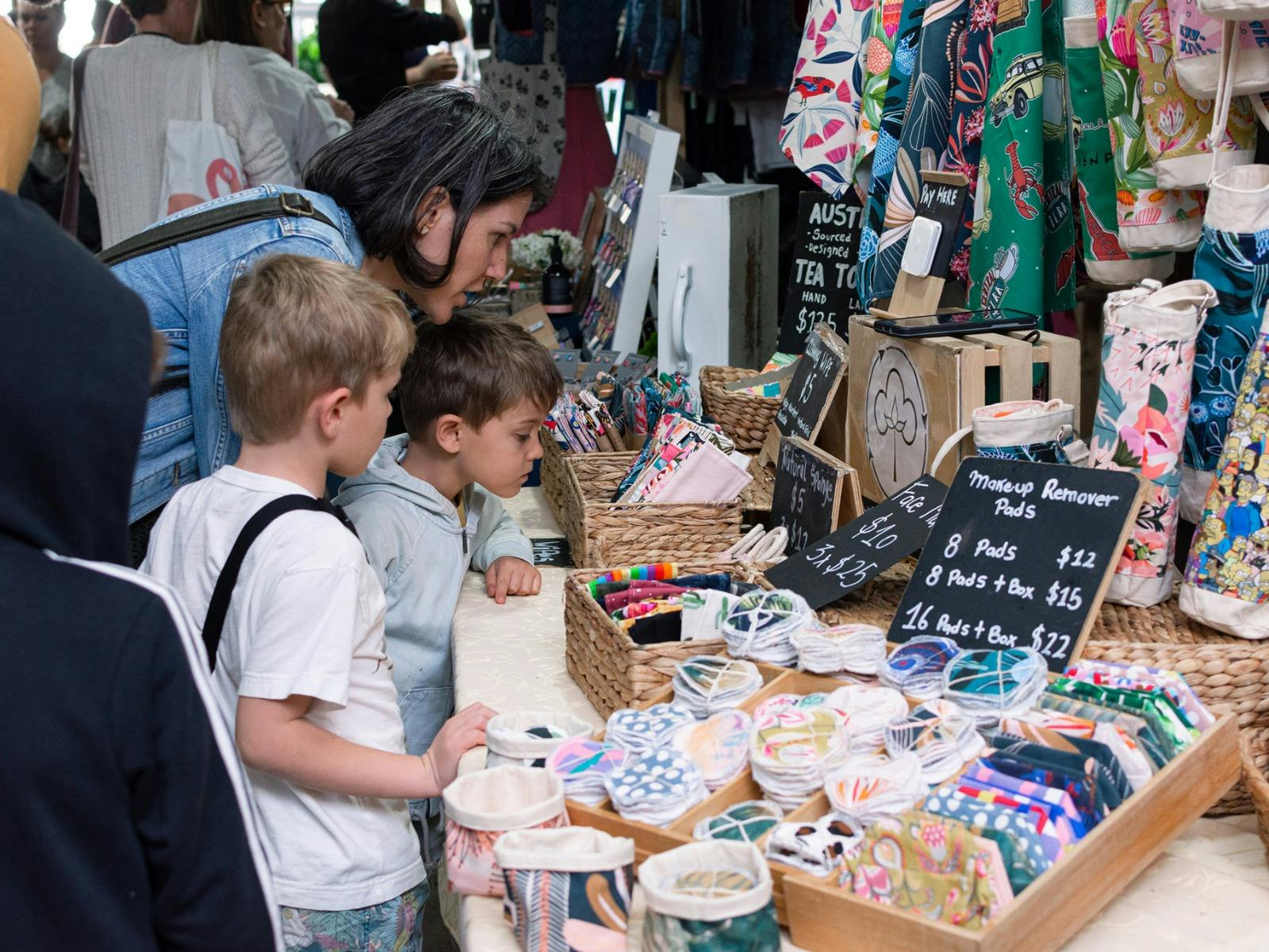 A Young Family looks at a fabric stall