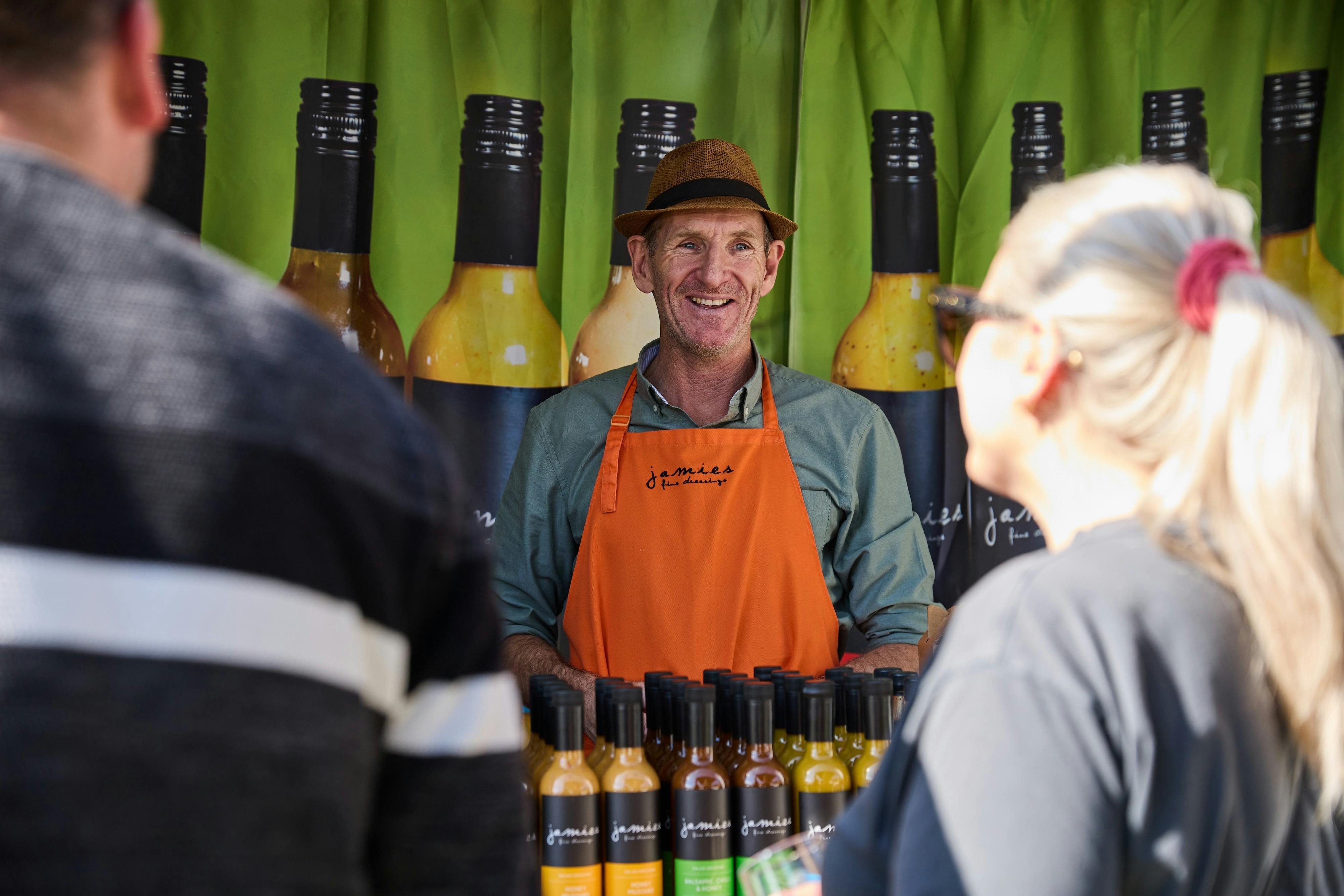People shopping at the Jamies Fine Dressings stall at Grampians Grape Escape