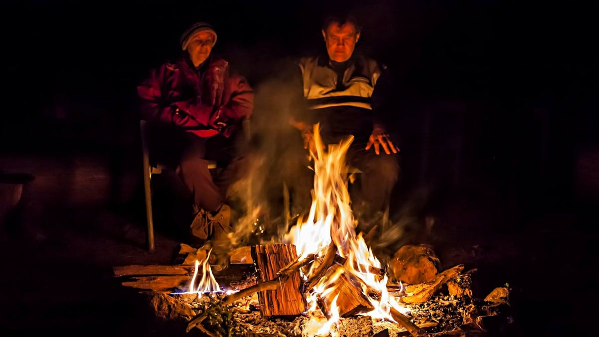 Sitting around the campfire at night