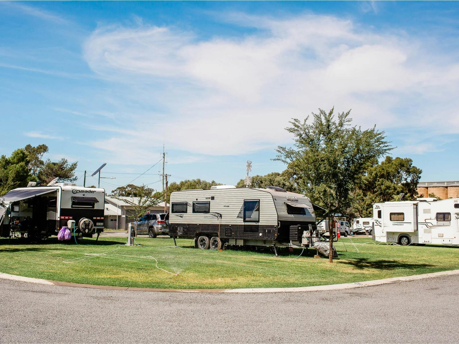Caravan park lawn space with caravan in place