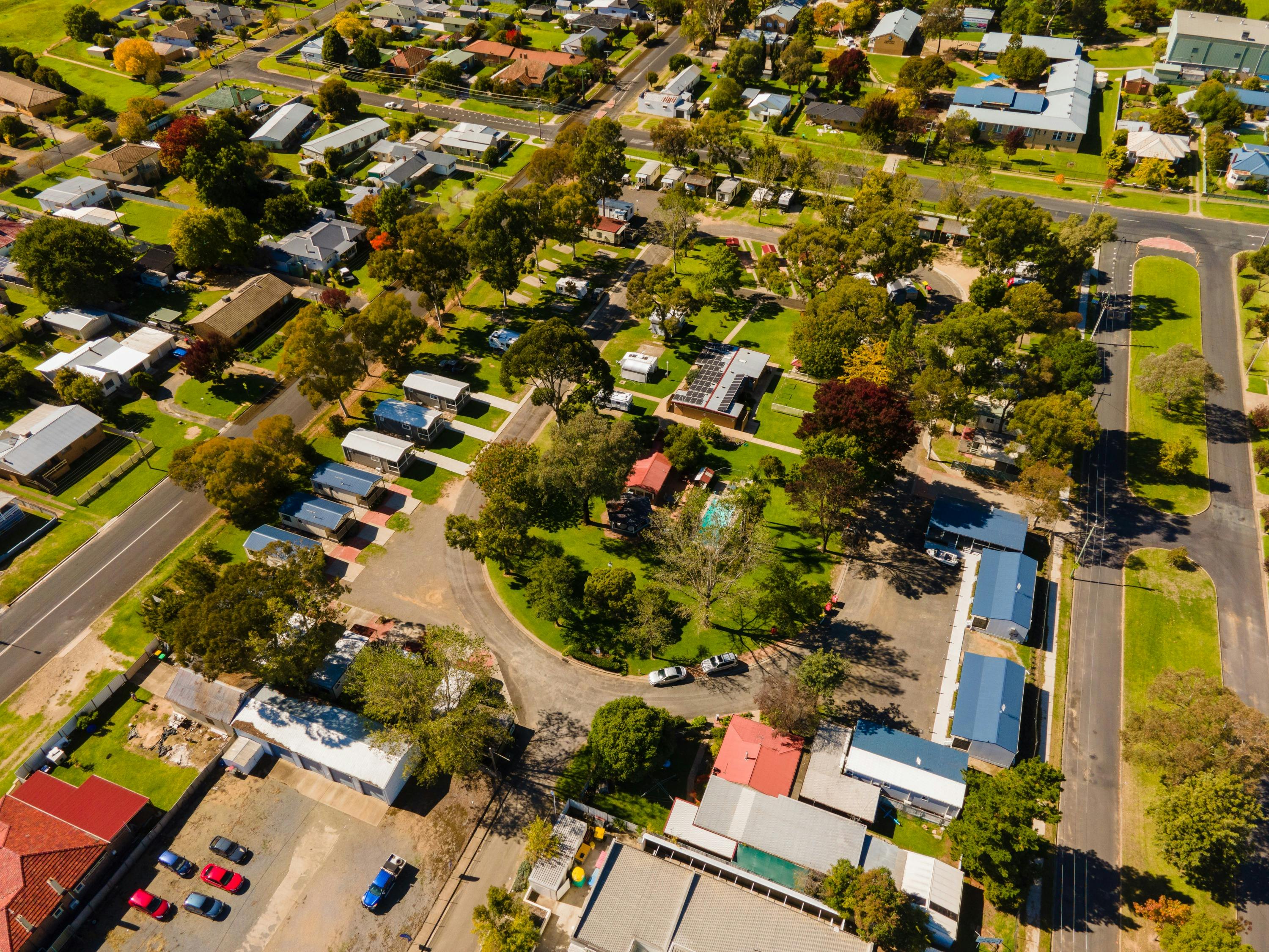 Drone view of caravan park - a decent-sized park with a mix of cabins and powered/unpowered sites.