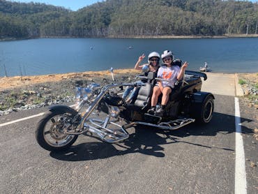 Image shows a boom mustang trike parked near the waterfront of Hinze Dam. Image shows a boom mustang trike parked near the waterfront of Hinze Dam.