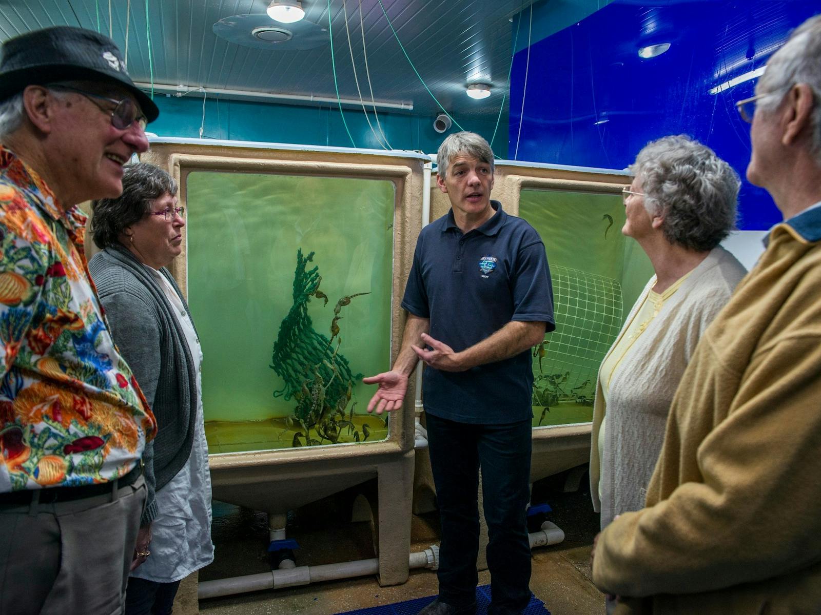 Manager describing breeding to guests