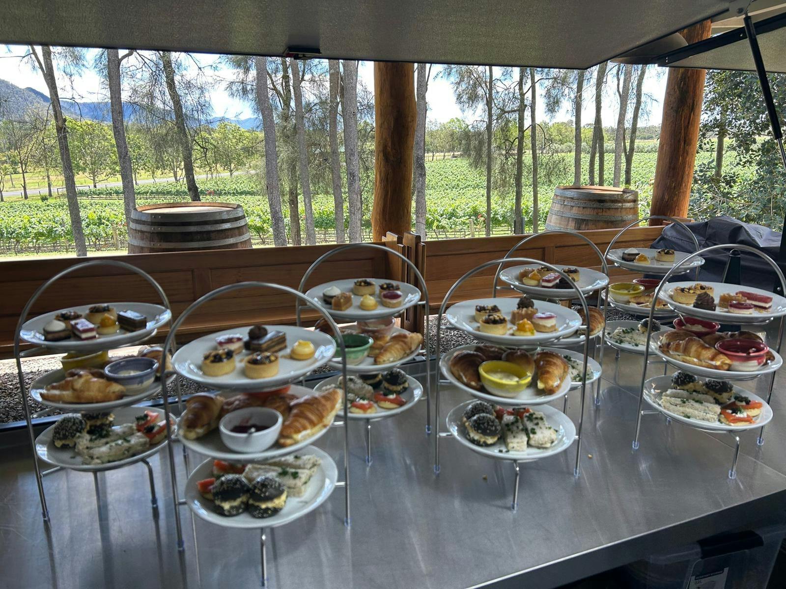 Tired plates of gourmet treats sit on a table