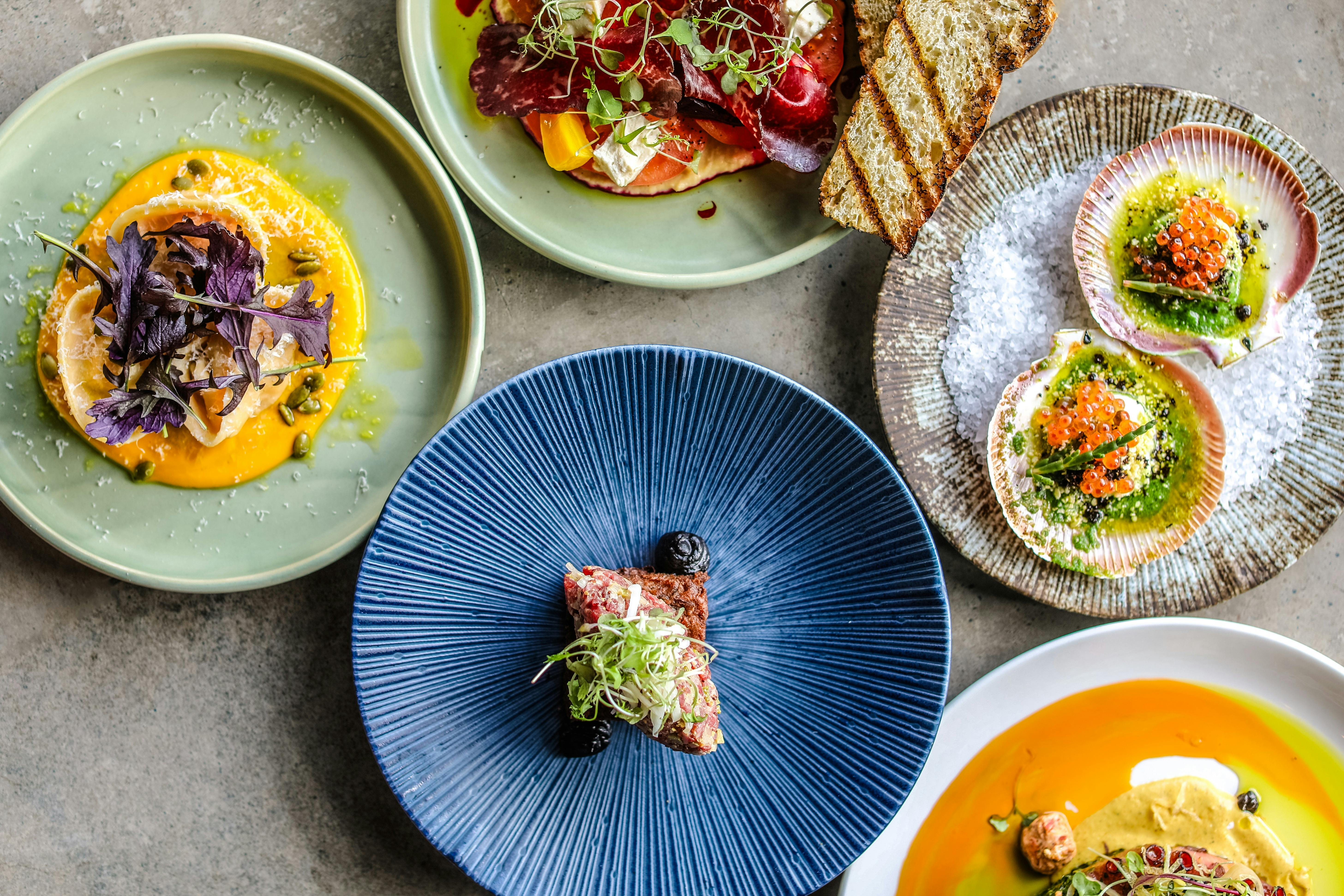 A flat lay photo of various Spring menu dishes