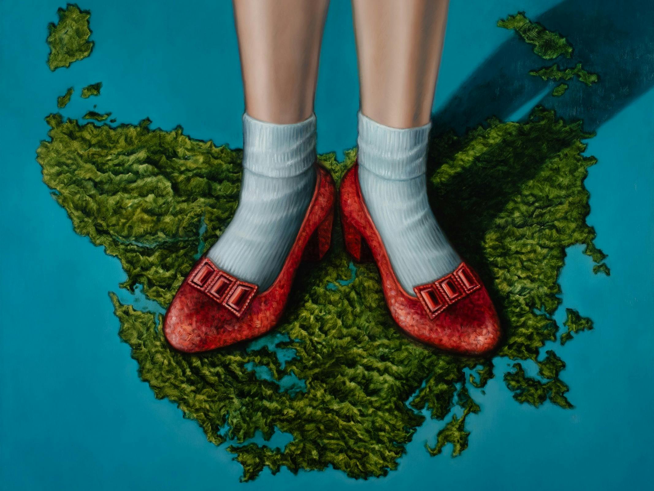 Amber’s painting features a map of Tasmania with Dorothy from The Wizard of Oz’s legs and slippers.