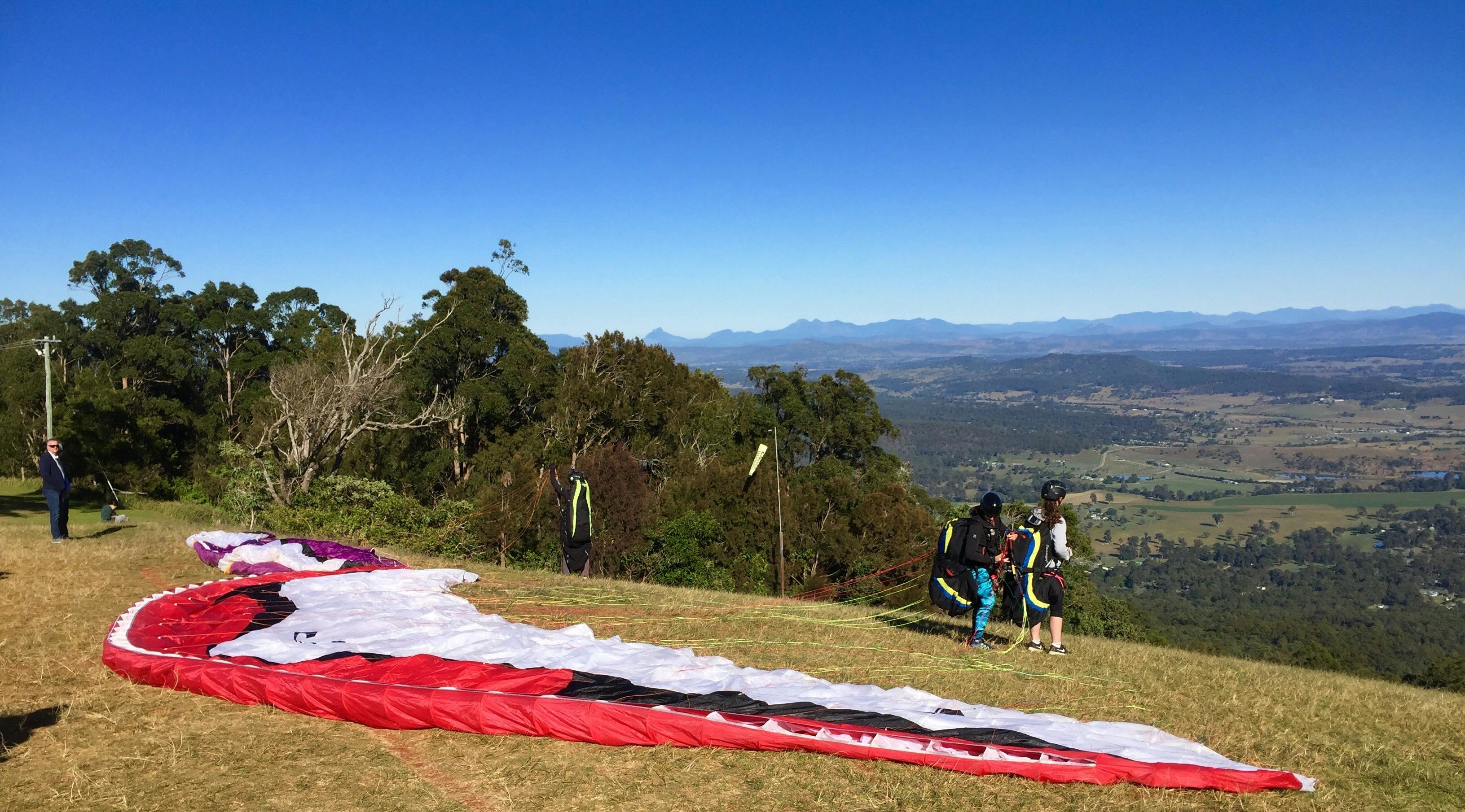 Getting ready to  tandem paraglide off the Gold Coast mountains with Lisa
