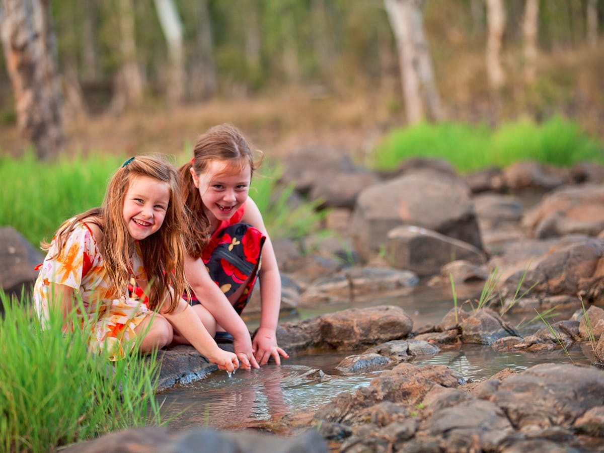 kids playing in stream