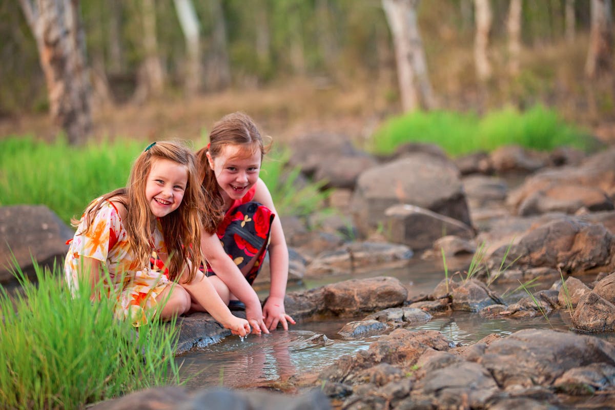 kids playing in stream