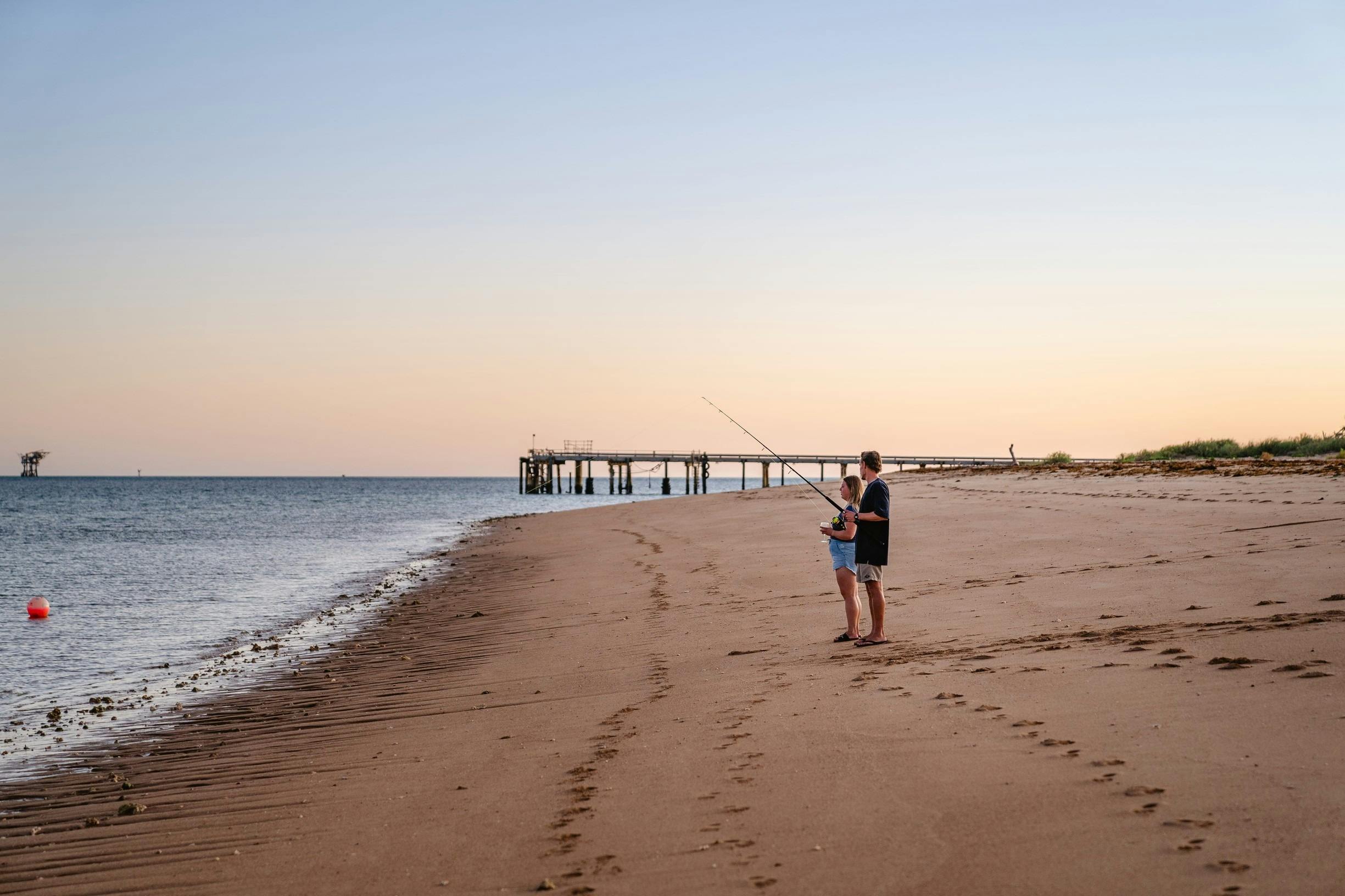 Couple fishing on the beach on the Mackerel Islands near Onslow