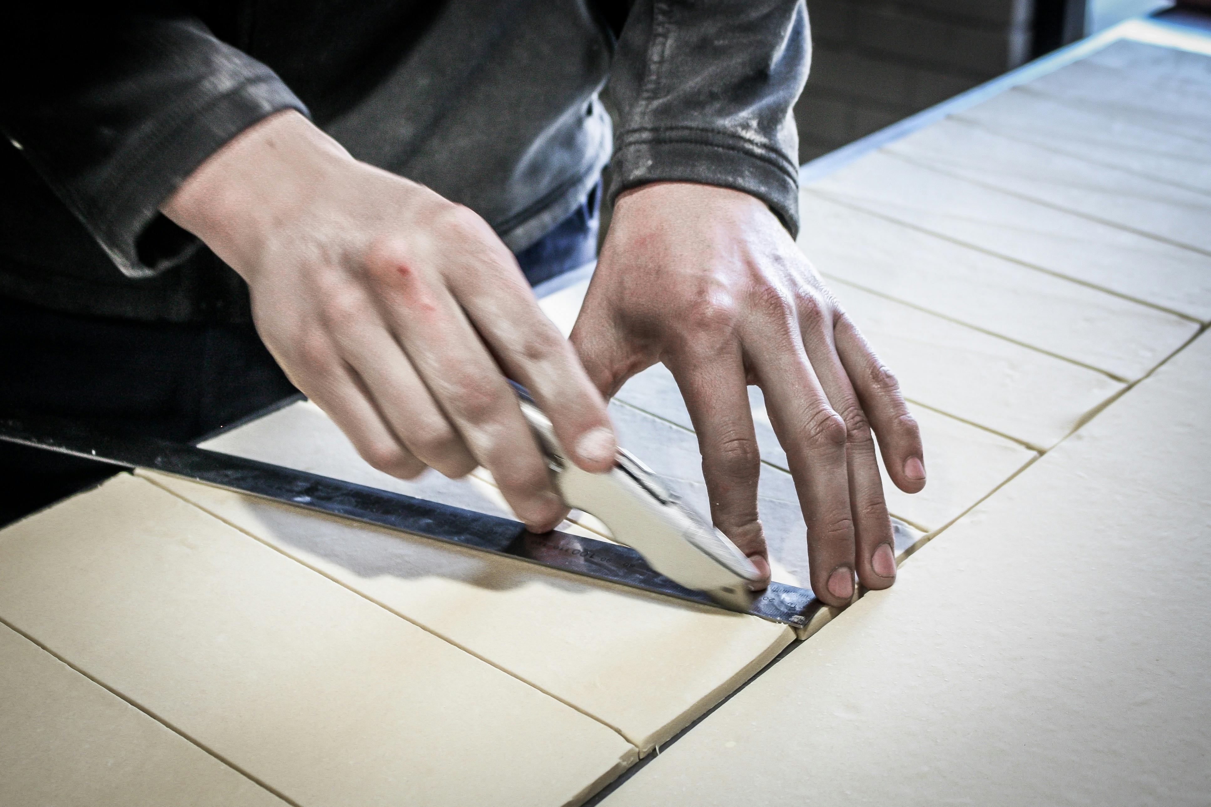 Cutting Laminated Dough ready to be rolled into croissants