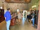 Photo of groups having a wine tasting in a Italian style stone tasting room