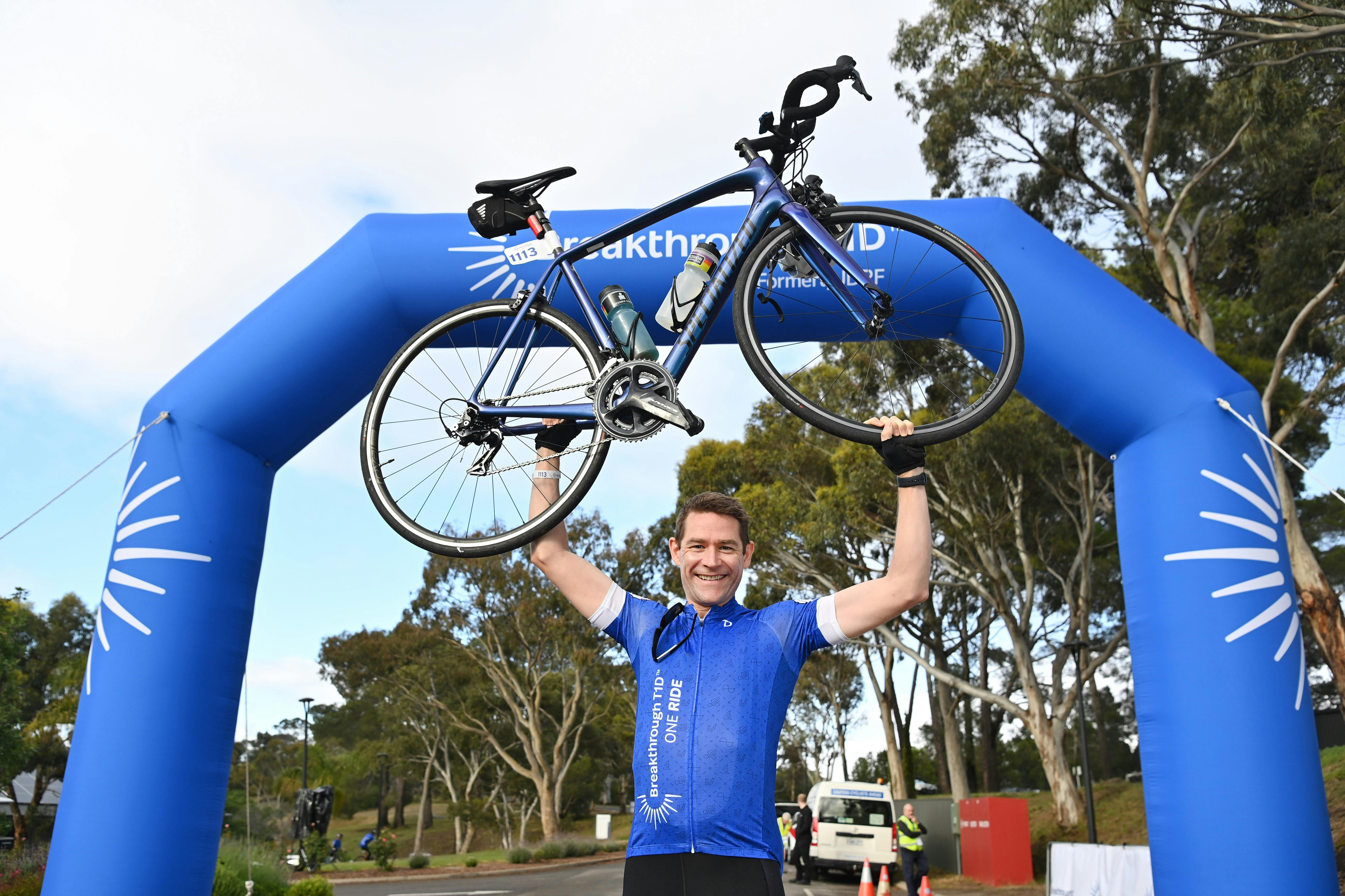 Rider holding up bike