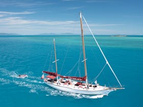Lady Enid Sailing past Langford Island Whitsundays from Airlie Beach