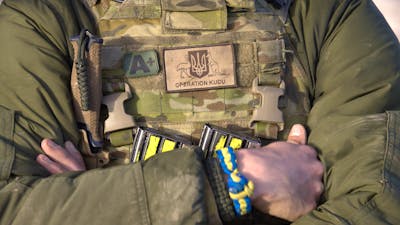 Soldier with operation Kudu patch and blue and yellow friendship braclelet