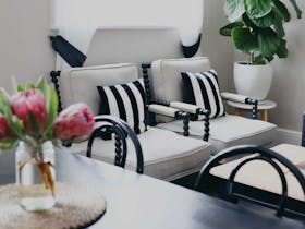 The spacious living and dining area inside the Post Office Apartment at the Customs House