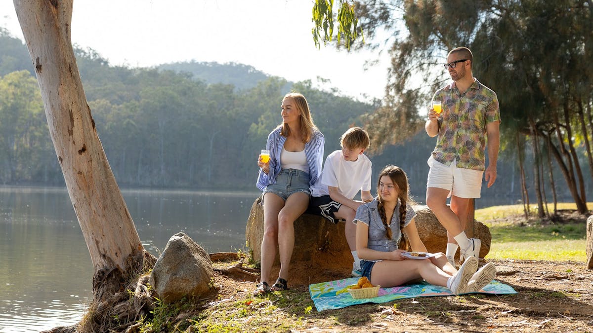 Young travellers enjoying a picnic at No 7 Dam, Mount Morgan. Young travellers enjoying a picnic at No 7 Dam, Mount Morgan.