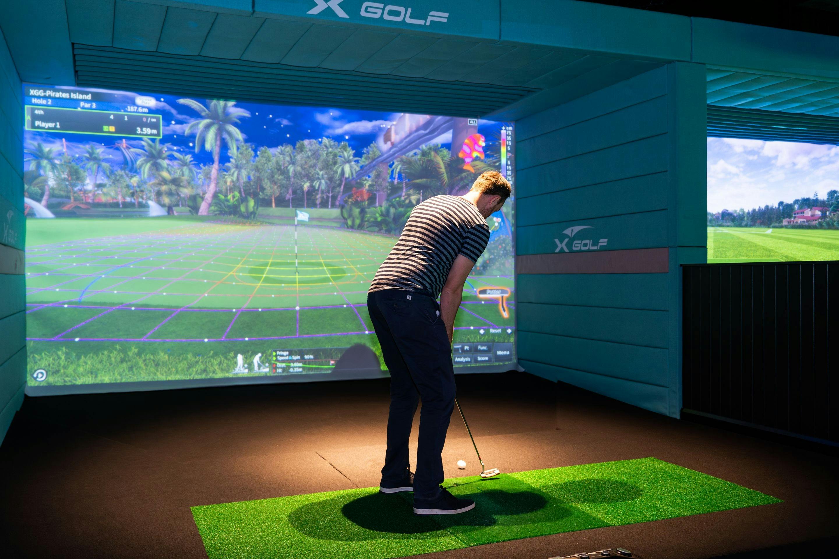 One person playing golf at X-Golf