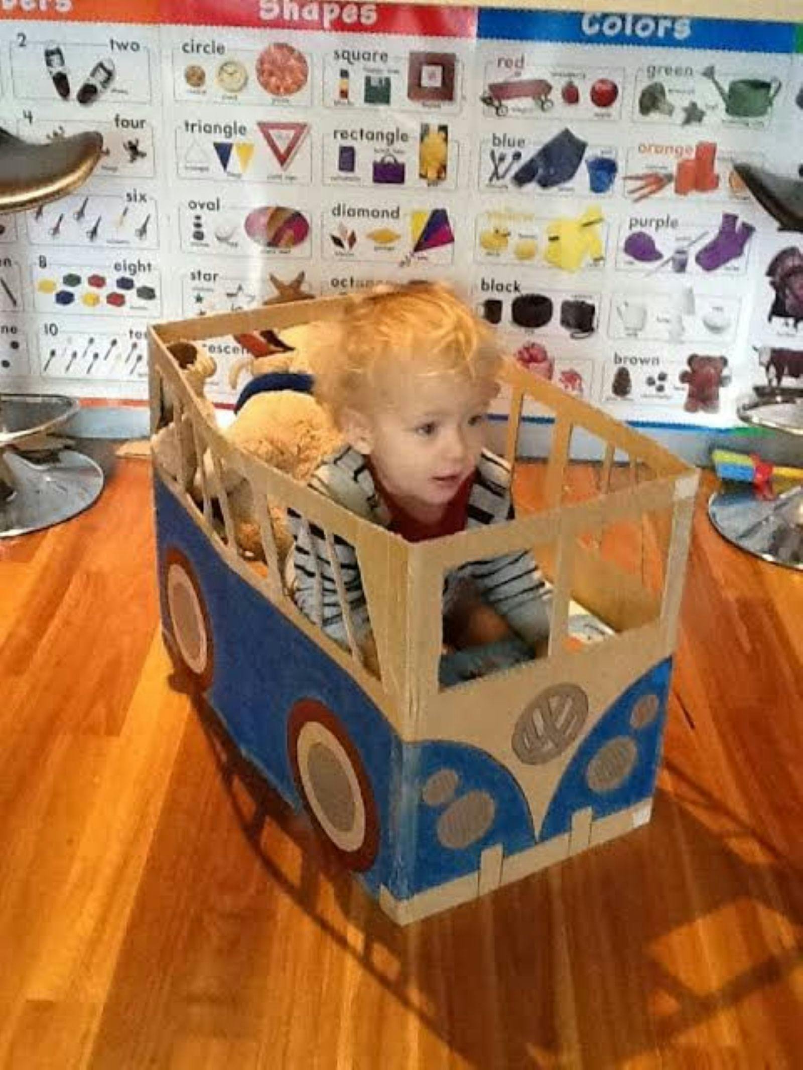 Image of child in box car