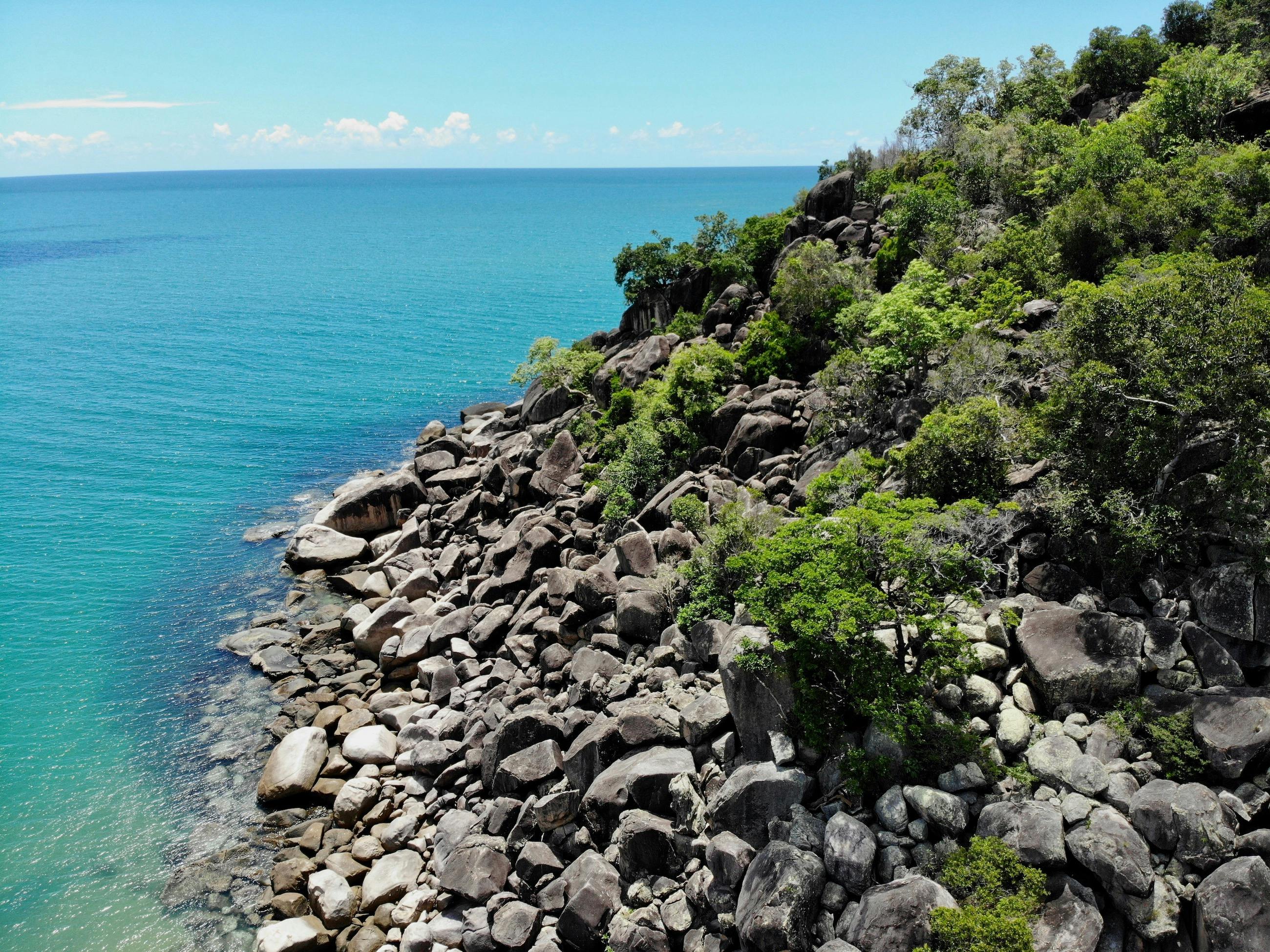 Magnetic Island coastline with rocks and hoop pines