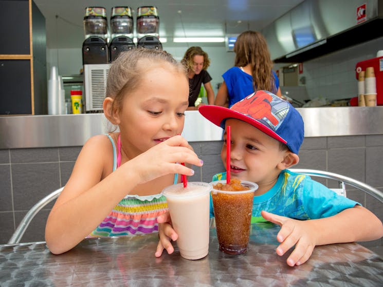 Children having drinks at the cafe