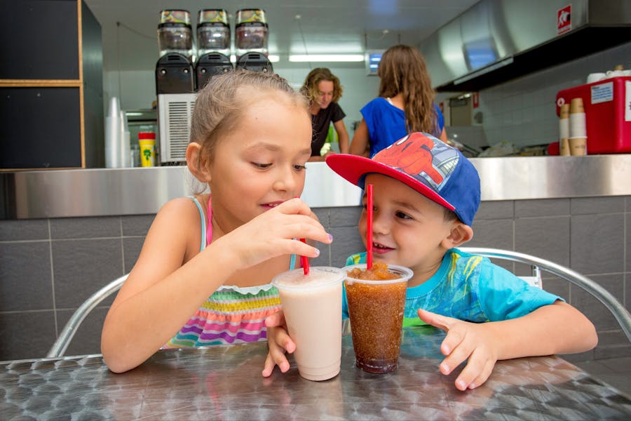 Children having drinks at the cafe