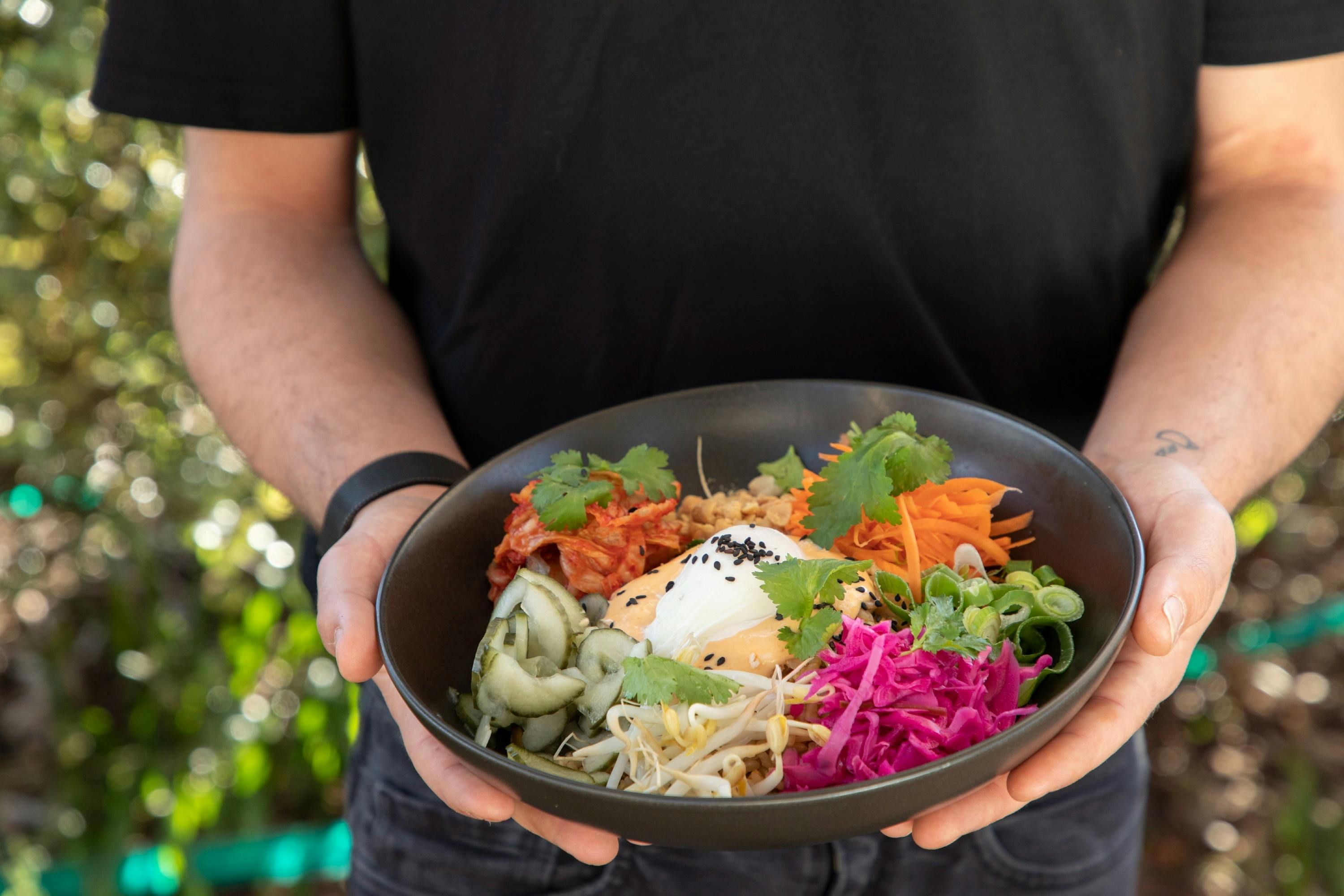 Waiter serviing a meal at the Mossy