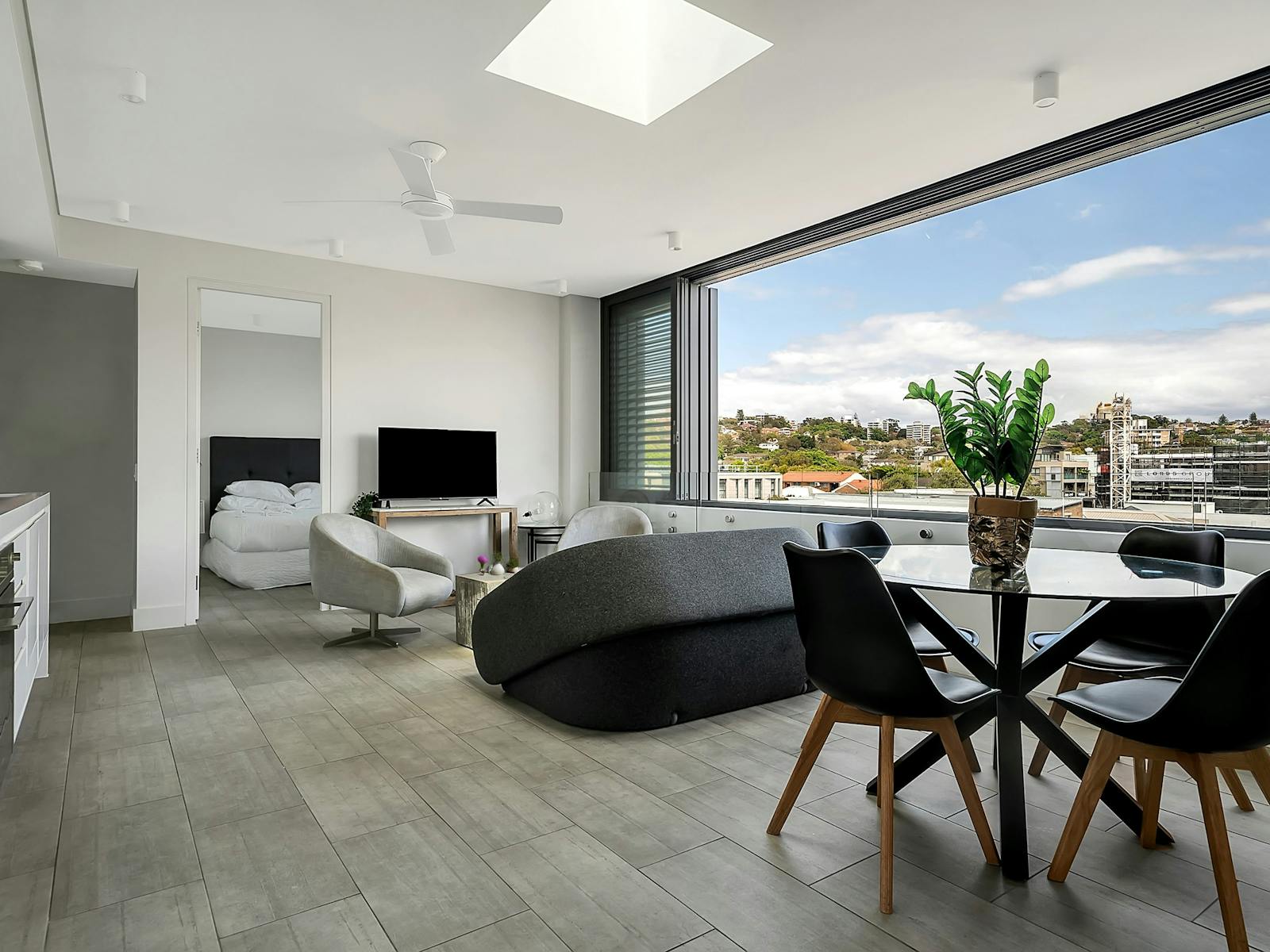 Open-plan living room with panoramic views of the city skyline.