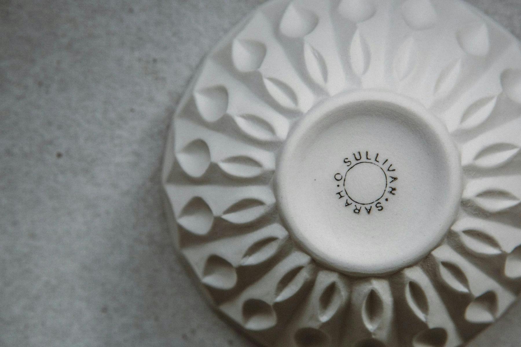 Underside of a white ceramic bowl by Sarah O'Sullivan