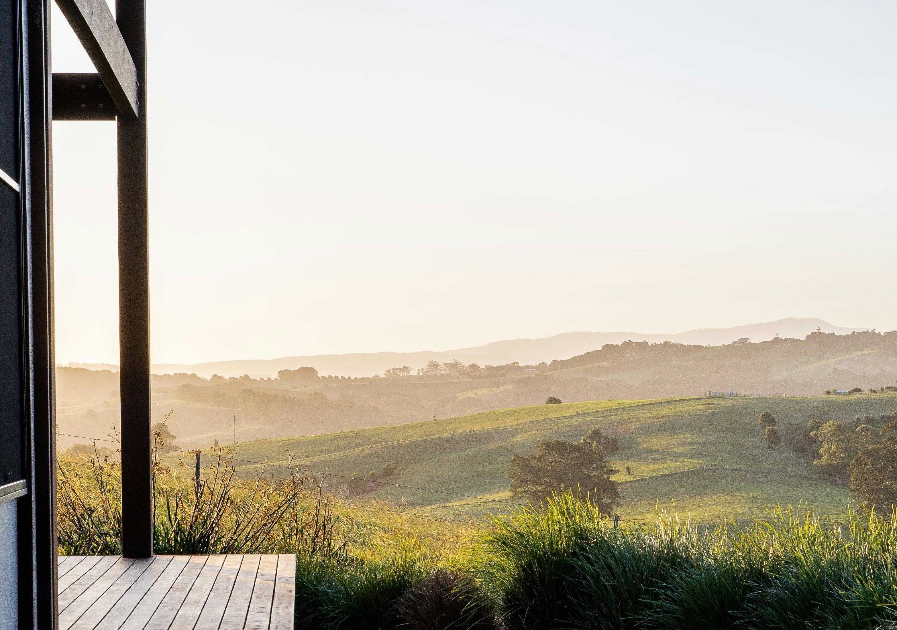 Sunset view from the deck at Carinya Byron Bay.