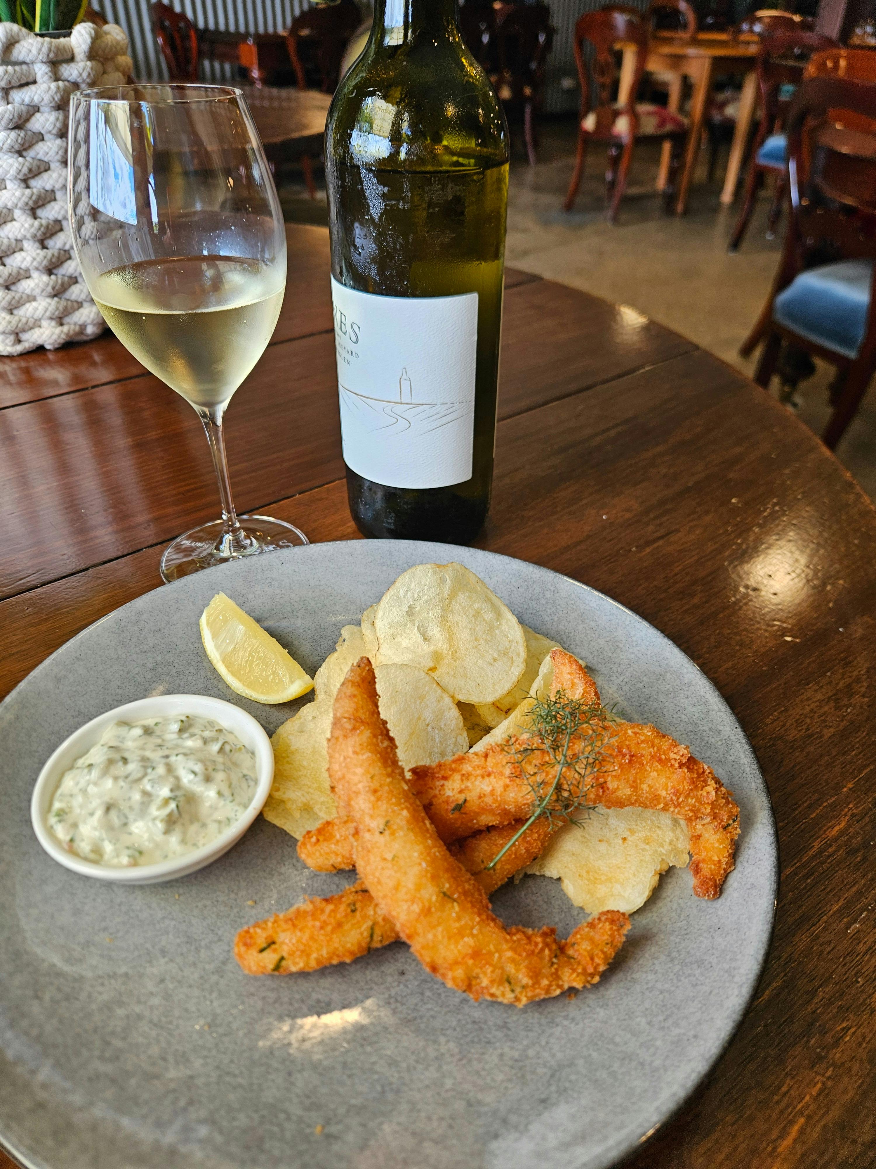 bottle of Fiano, Goujons and crisps
