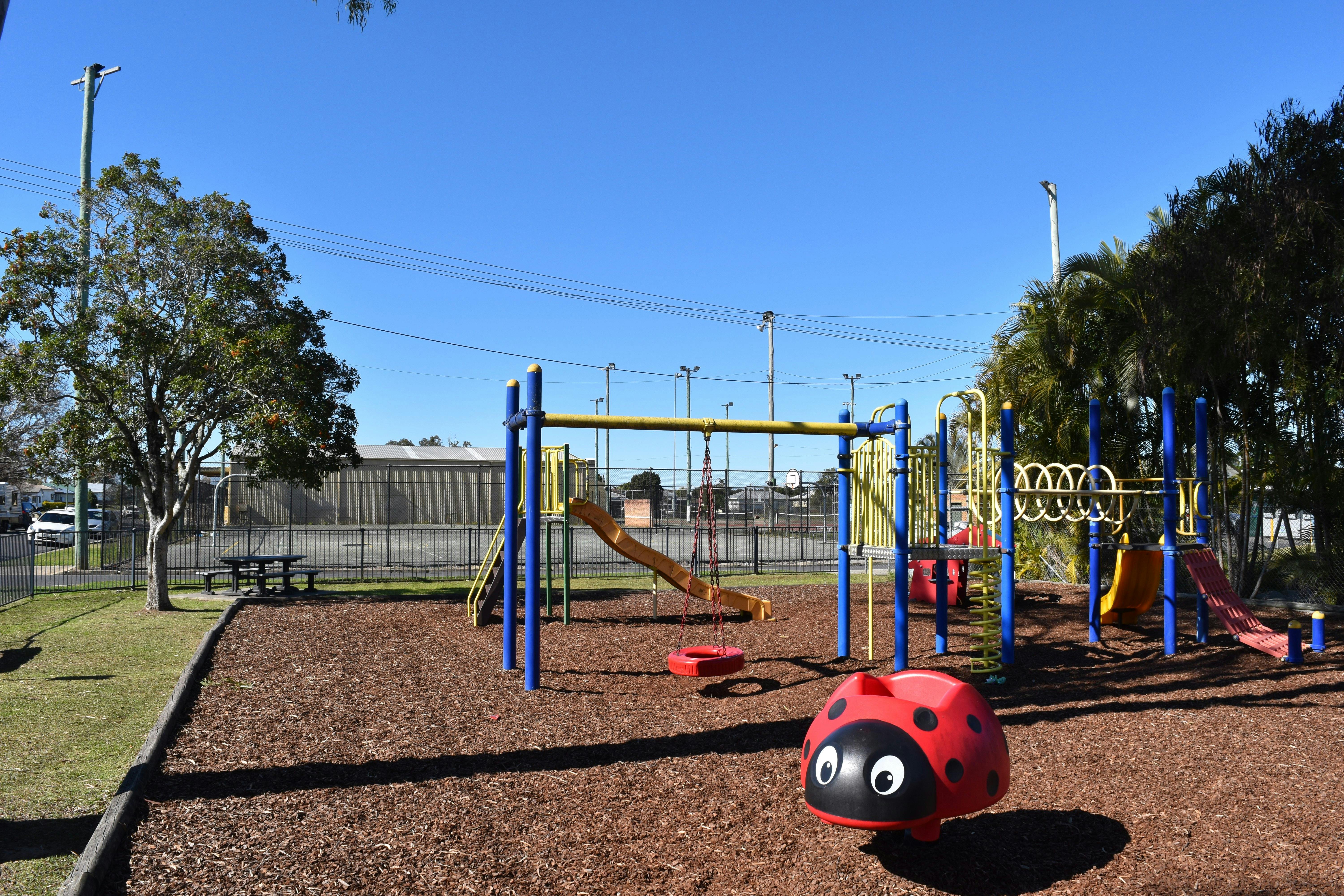 Fenced children's playground, picnic tables, shade and toilets near.  Next to Pool. Partridge St.