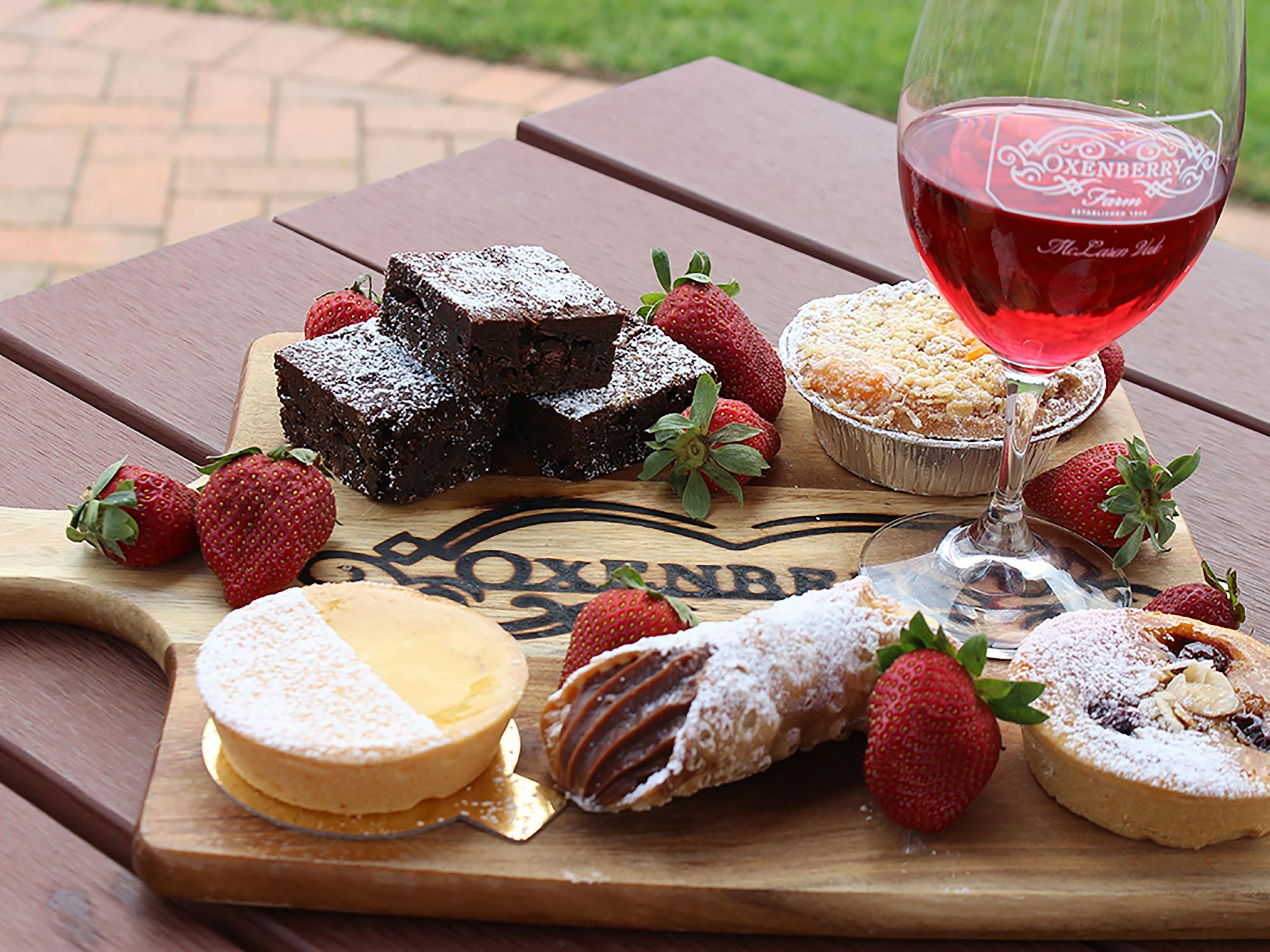 oxenberry cheese platter with a glass rose