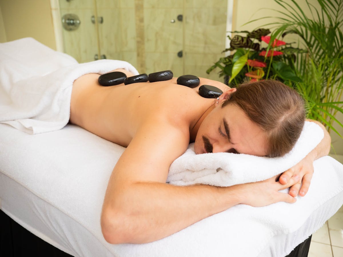 Man getting a hot stone massage