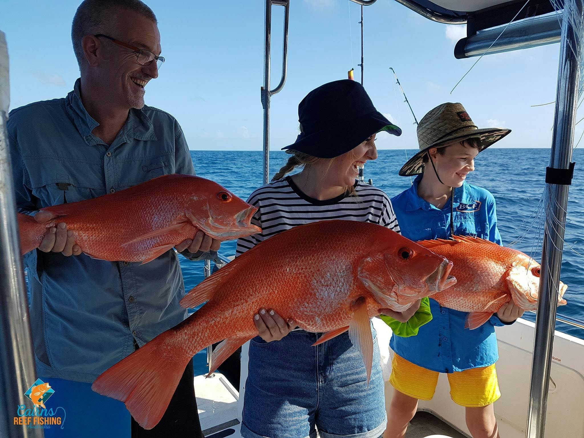 A happy family on a private charter holding some beautiful Saddletail Snapper