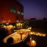 An outdoor bath under a star studded sky