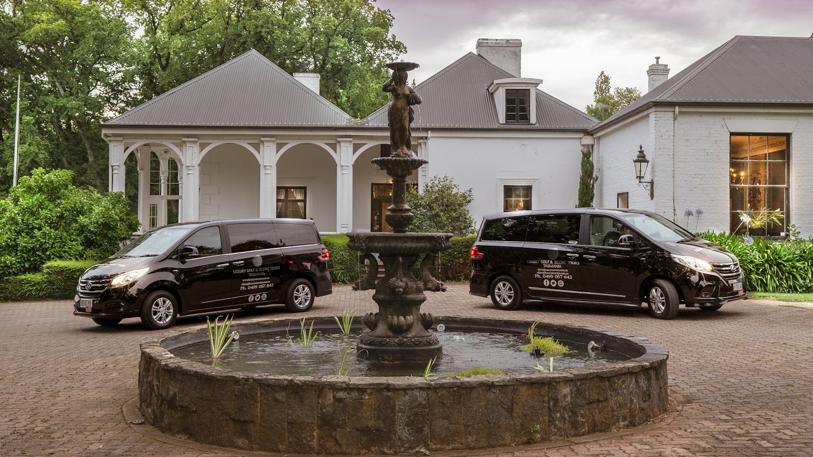Our luxury vans in front of the gorgeous Quamby Estate