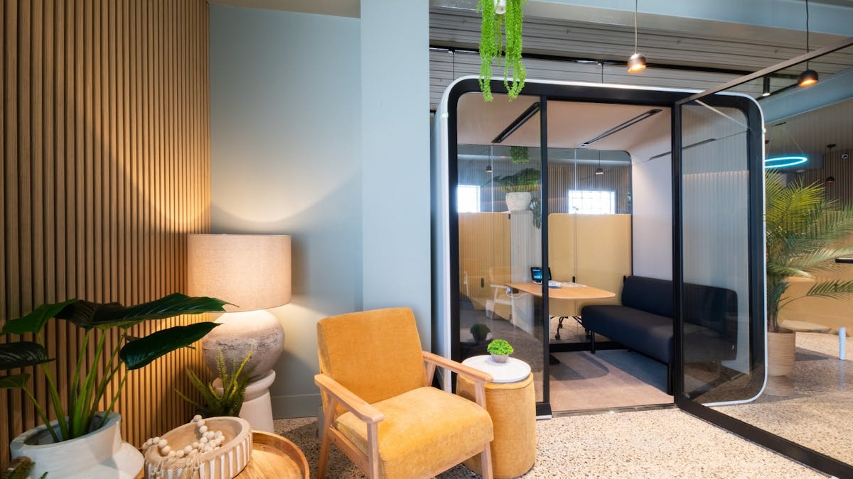 Cosy Wi-Fi lounge with natural light and casual seating for remote workers.
