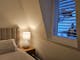 Cosy bedrooms with a table lamp and mountain views